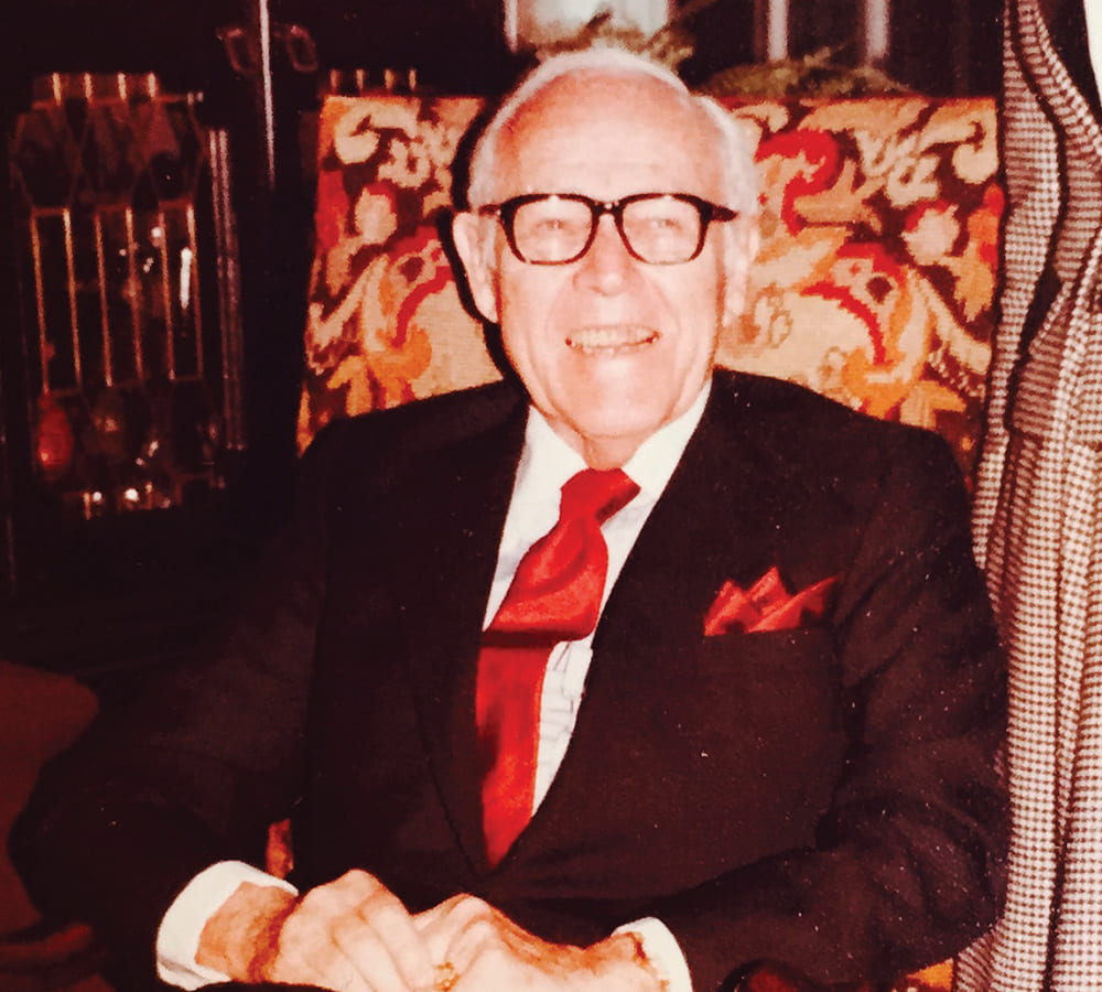 Jack C. Massey sitting in a chair