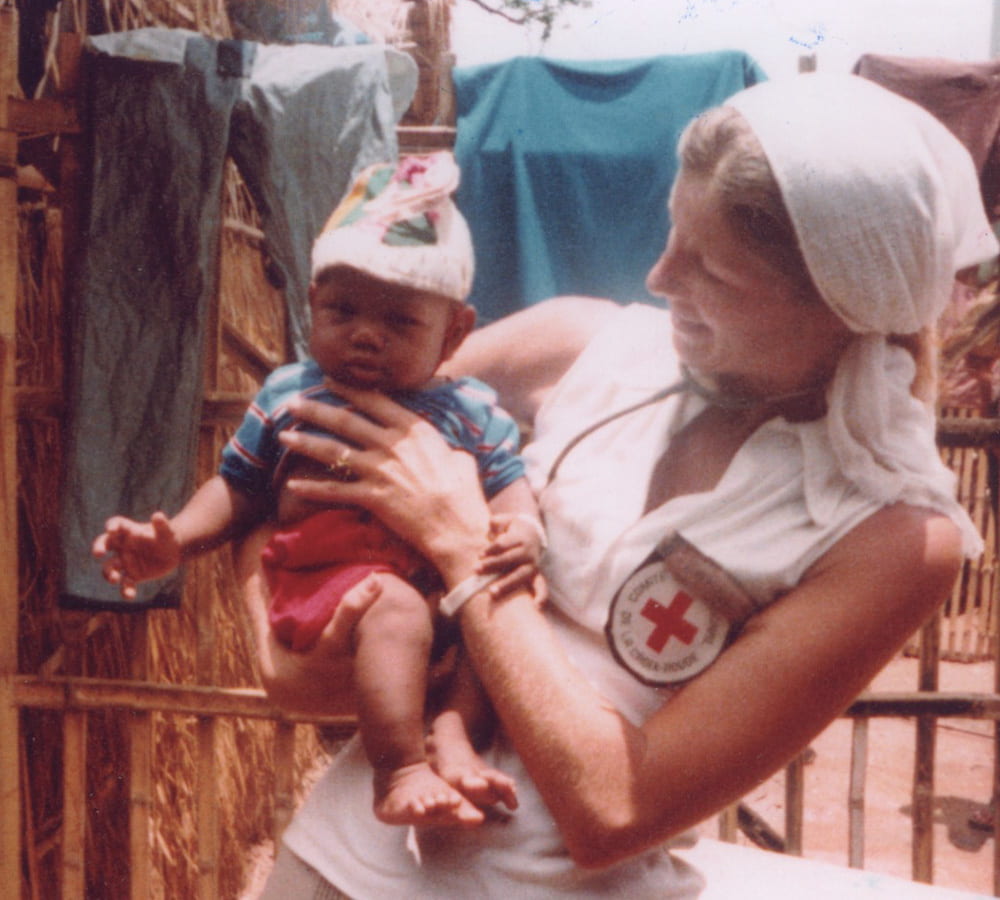 Carol Etherington holding a a baby