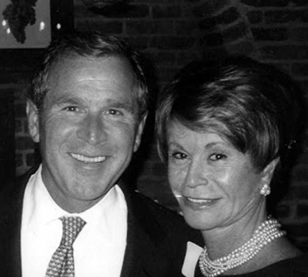 A photo of Colleen Conway Welch and President George W. Bush